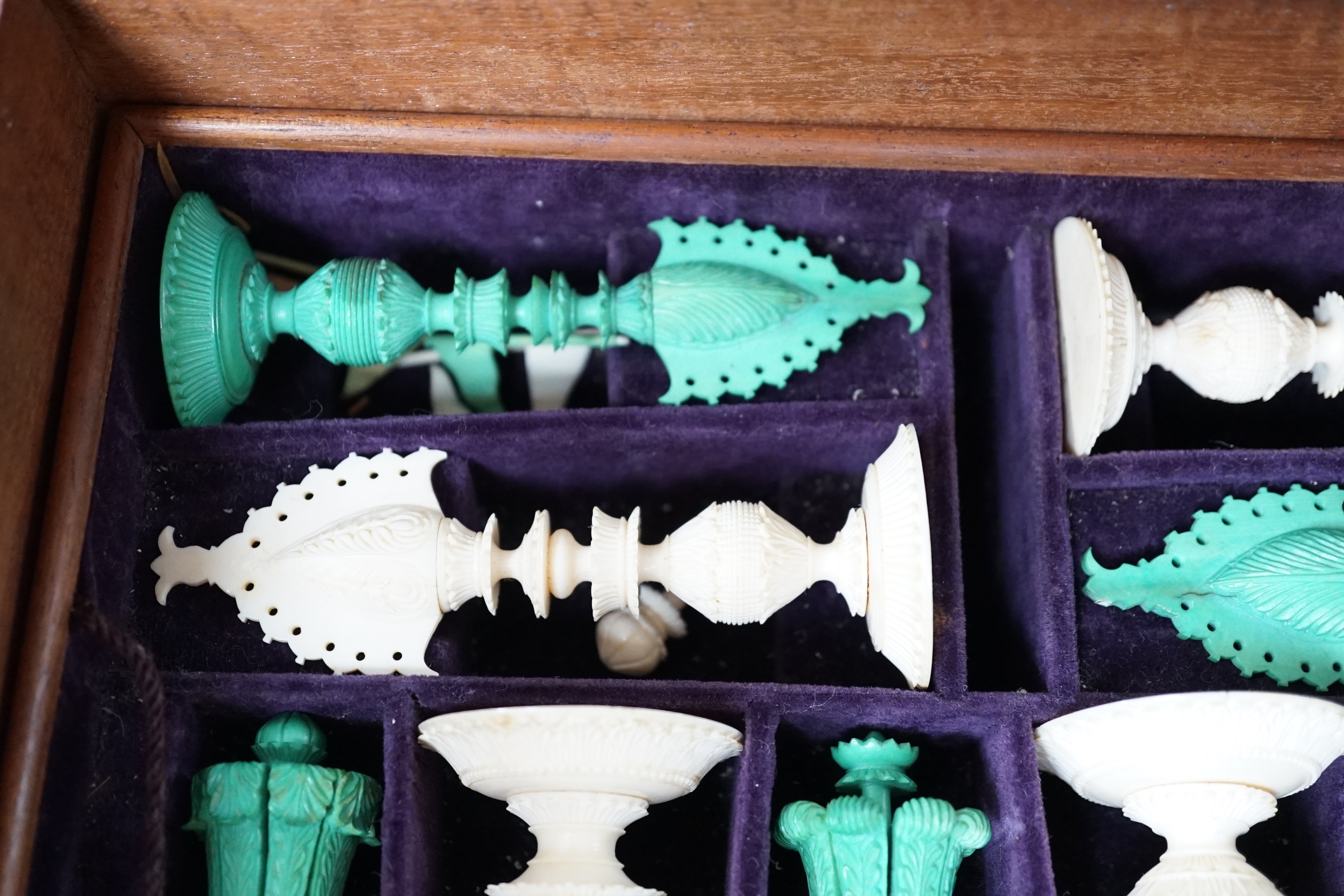 A boxed 19th century Burmese pattern ivory chess set, one pawn restored, king height 11cm